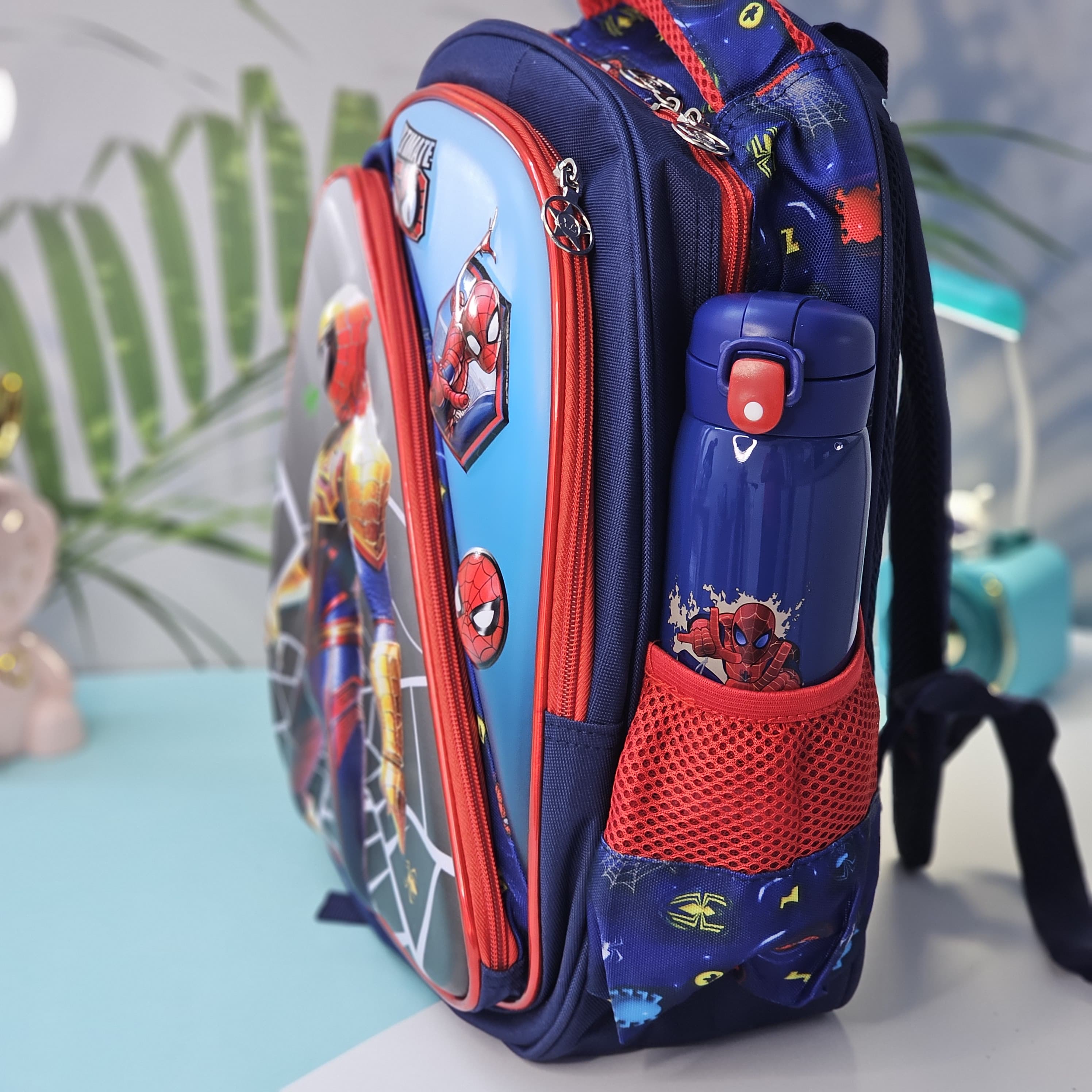 "Stylish and practical Usmile Toys backpack for boys, adorned with popular cartoon superhero characters, including Iron Man and Thor." www.usmile.com